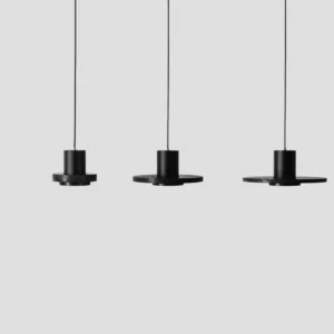 Set of three matching black stone pendant lamps displayed side by side - mid-century modern ceiling fixtures