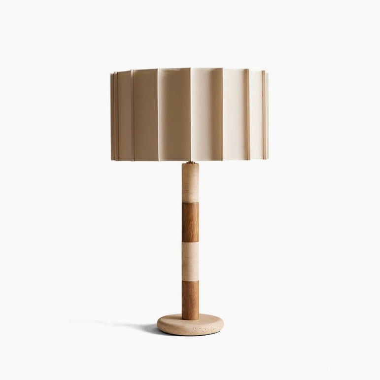 Calypso natural travertine table lamp full view studio shot featuring pleated shade and segmented stacked base design