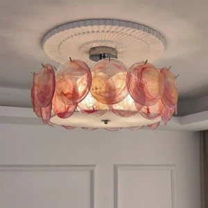 Pink glass flush mount ceiling light installed in bedroom with scalloped ceiling medallion, overhead view showing shadowless illumination