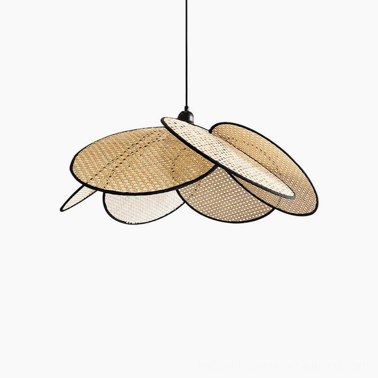Compact natural rattan petal pendant light with black edging showing hand-woven detail and organic flower-inspired form in studio setting