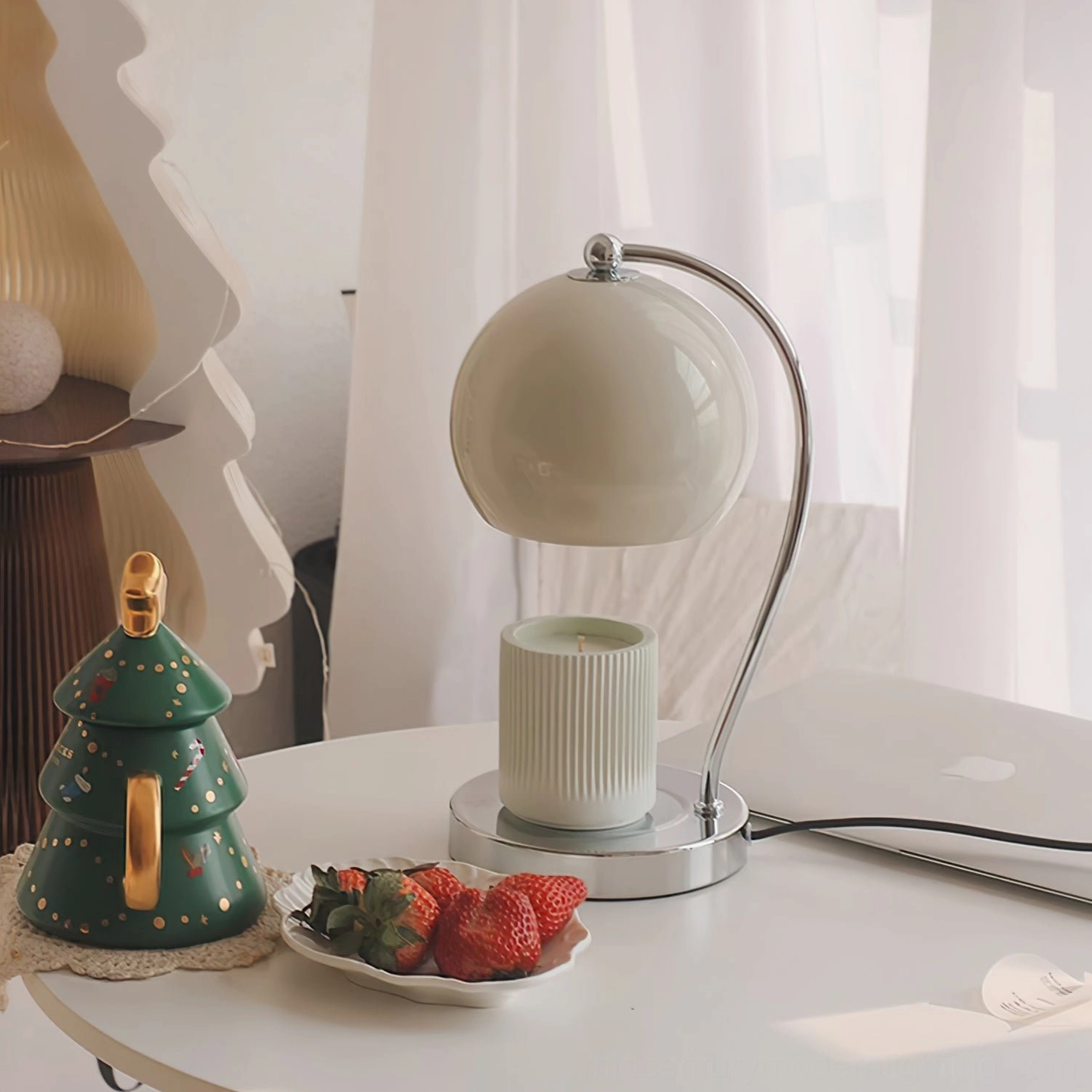Off-white spherical lamp festive dining table styling with Christmas decor and strawberries