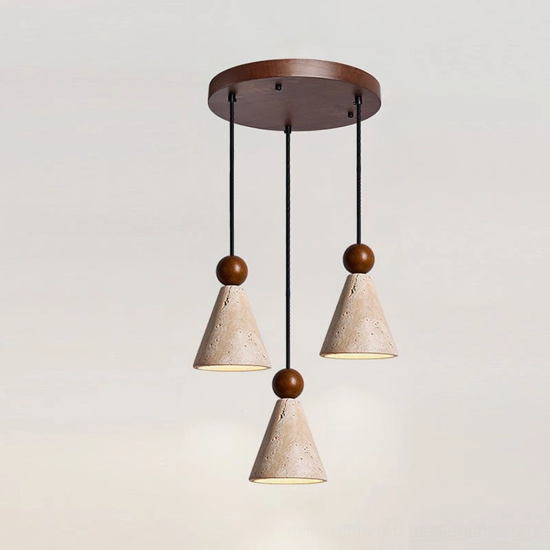 Round canopy three-light travertine pendant cluster above entryway foyer with modern organic styling