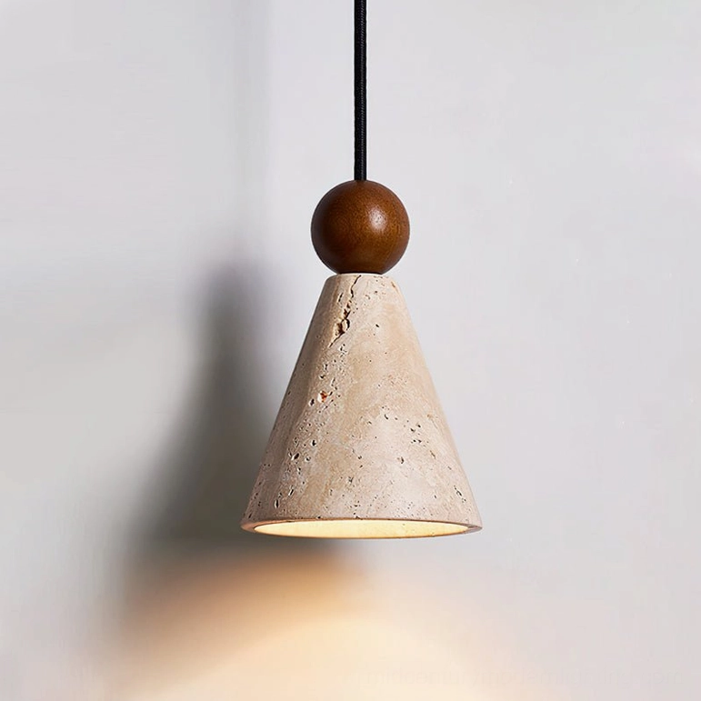Single-light Canyon travertine pendant with black fabric cord and natural stone cone shade detail