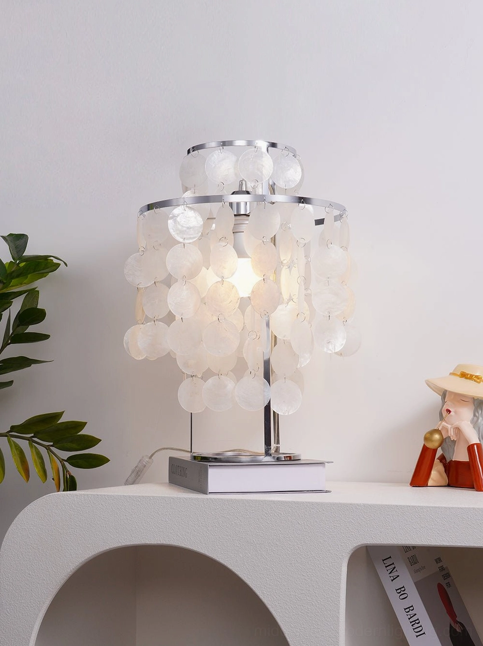 Capiz shell table lamp styled in contemporary minimalist interior with neutral decor
