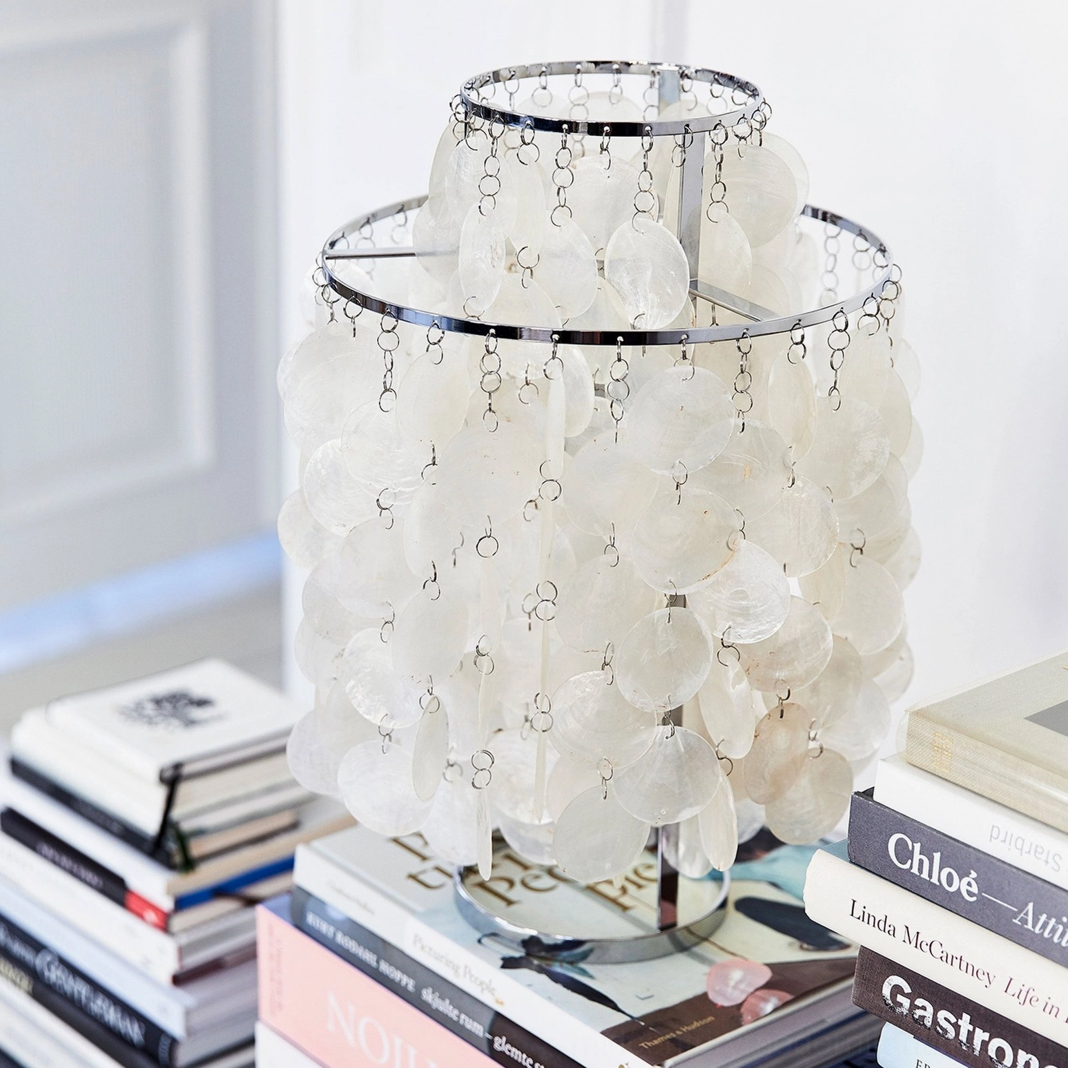 Capiz shell table lamp detail showing individual shell arrangement and metal rings