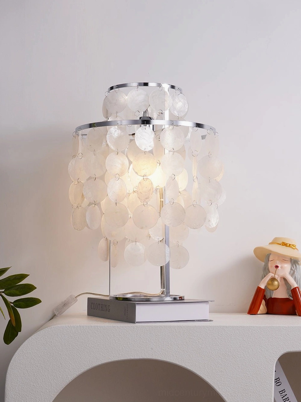 Contemporary mother-of-pearl capiz shell table lamp with stainless steel rings detail