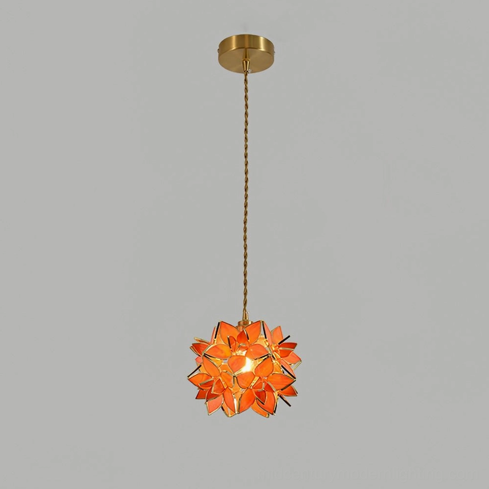 Capiz pendant variant with orange colored glass petals and gold brass finish studio view