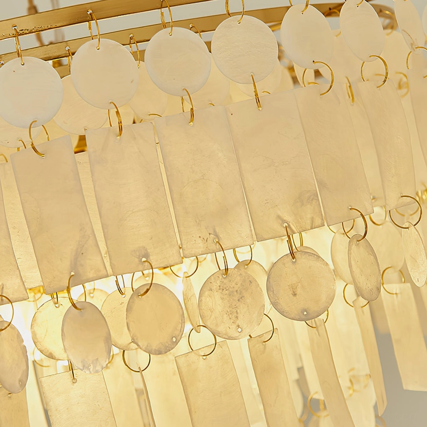 Capiz shell chandelier interior view showing light diffusion through translucent shells creating warm ambient glow