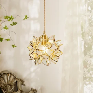Capiz flower pendant lamp with white frosted glass petals and gold brass fixture in romantic bedroom setting
