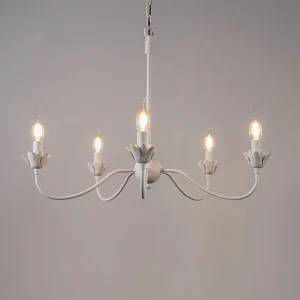 Lit Caposile 5-light white candle chandelier with curved metal arms front view