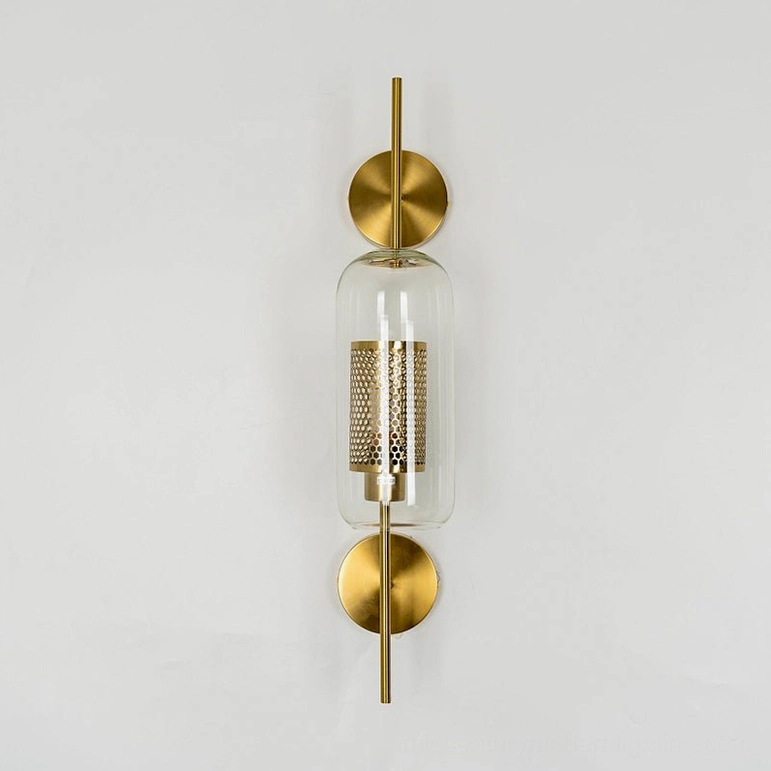 Modern glass wall sconce with capsule form and clear glass shade clarity