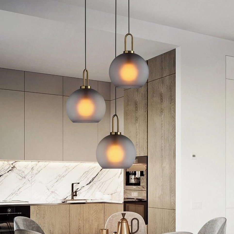 Capsule and sphere smoked glass pendant designs in frosted and clear glass comparison