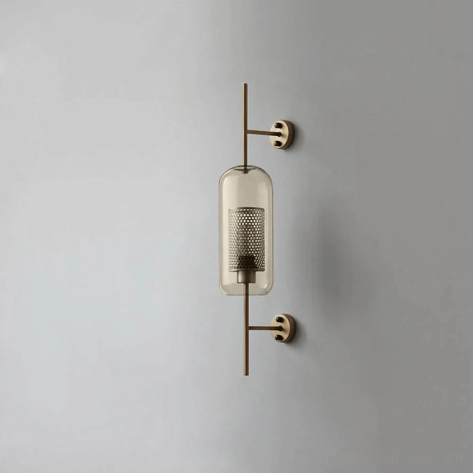 Contemporary glass sconce with capsule form and warm amber glass coloring