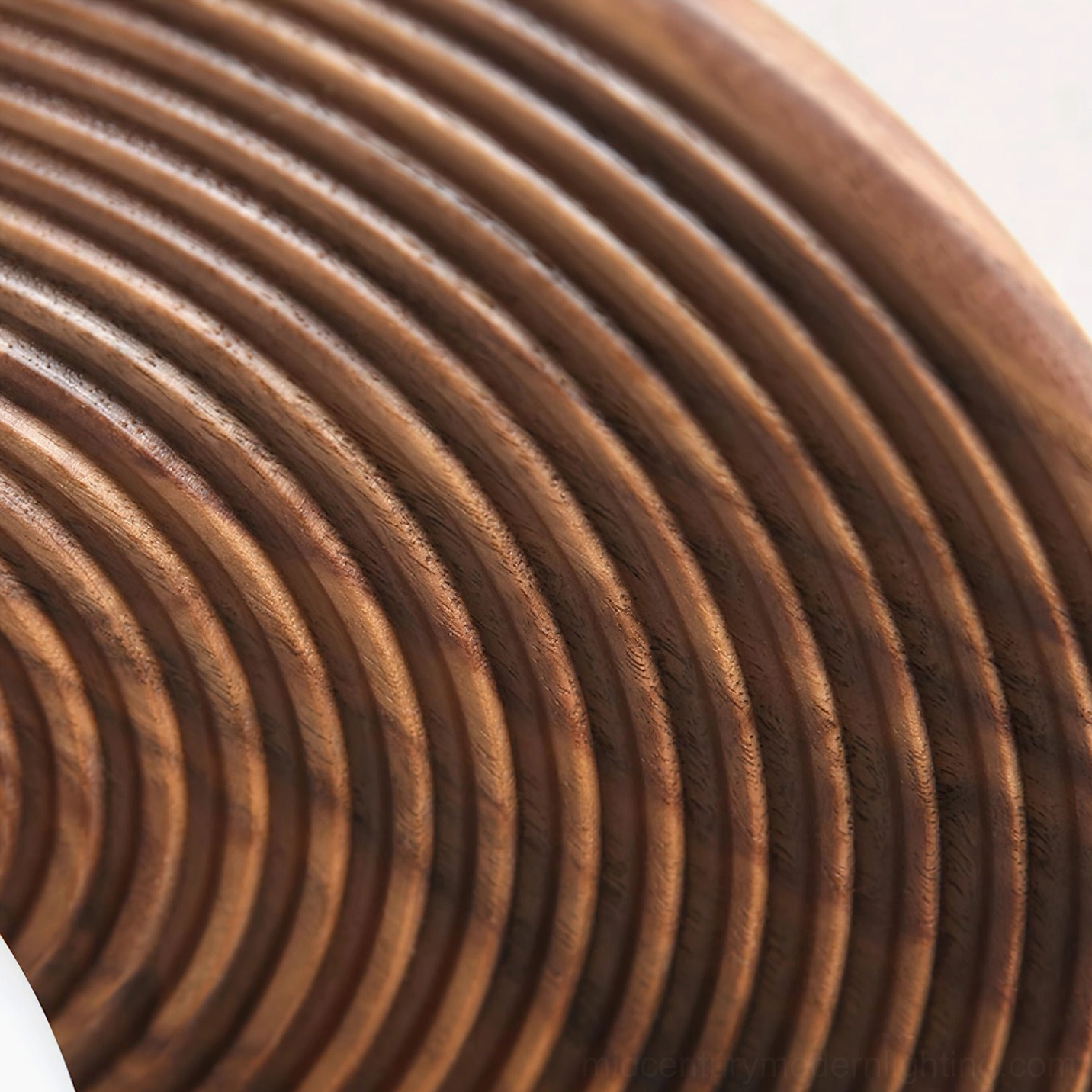Macro close-up of Carapace lamp shade concentric circular ribbed wood grain finish and organic texture detail