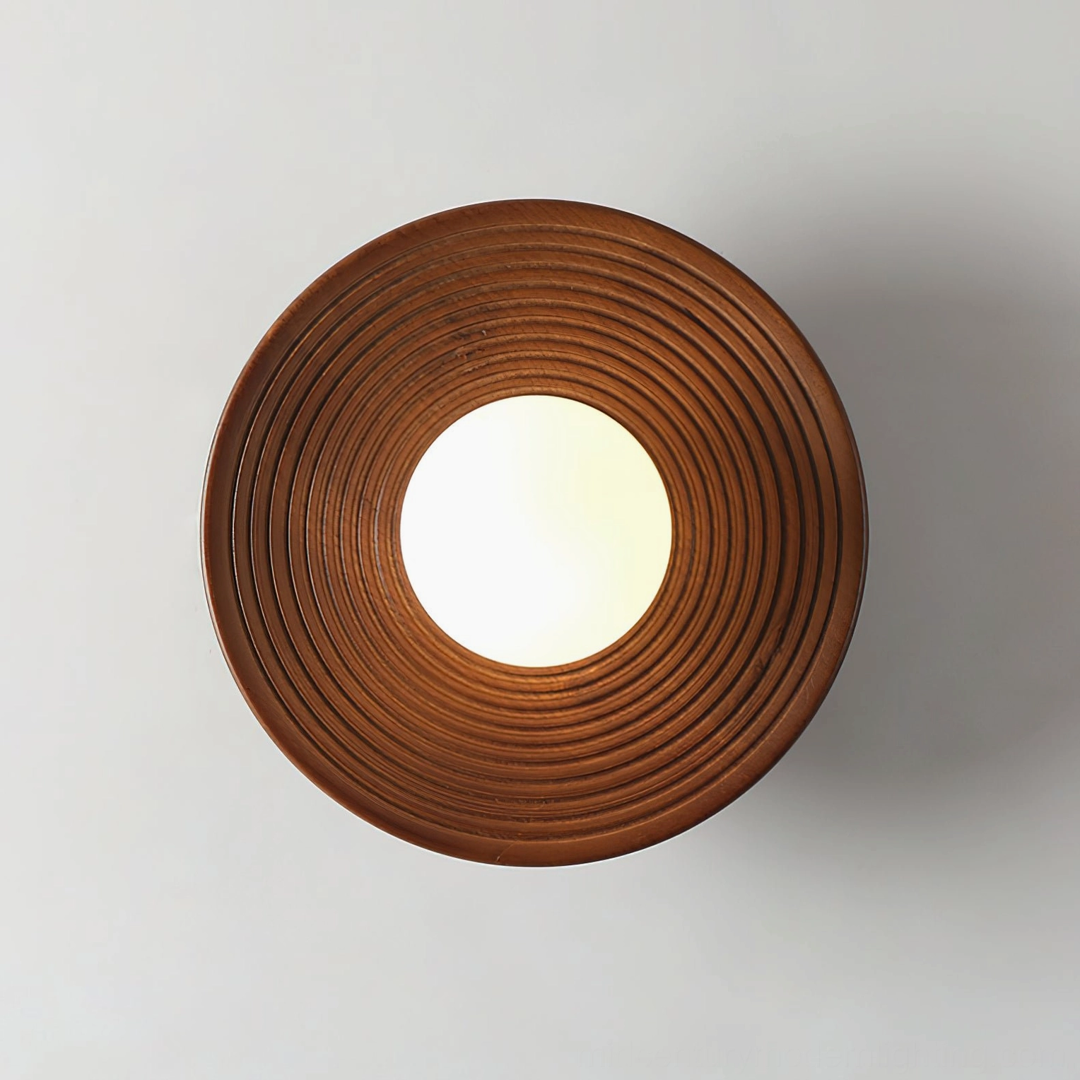 Front view of Carapace ribbed wooden shade showing circular concentric grain texture and wood craftsmanship