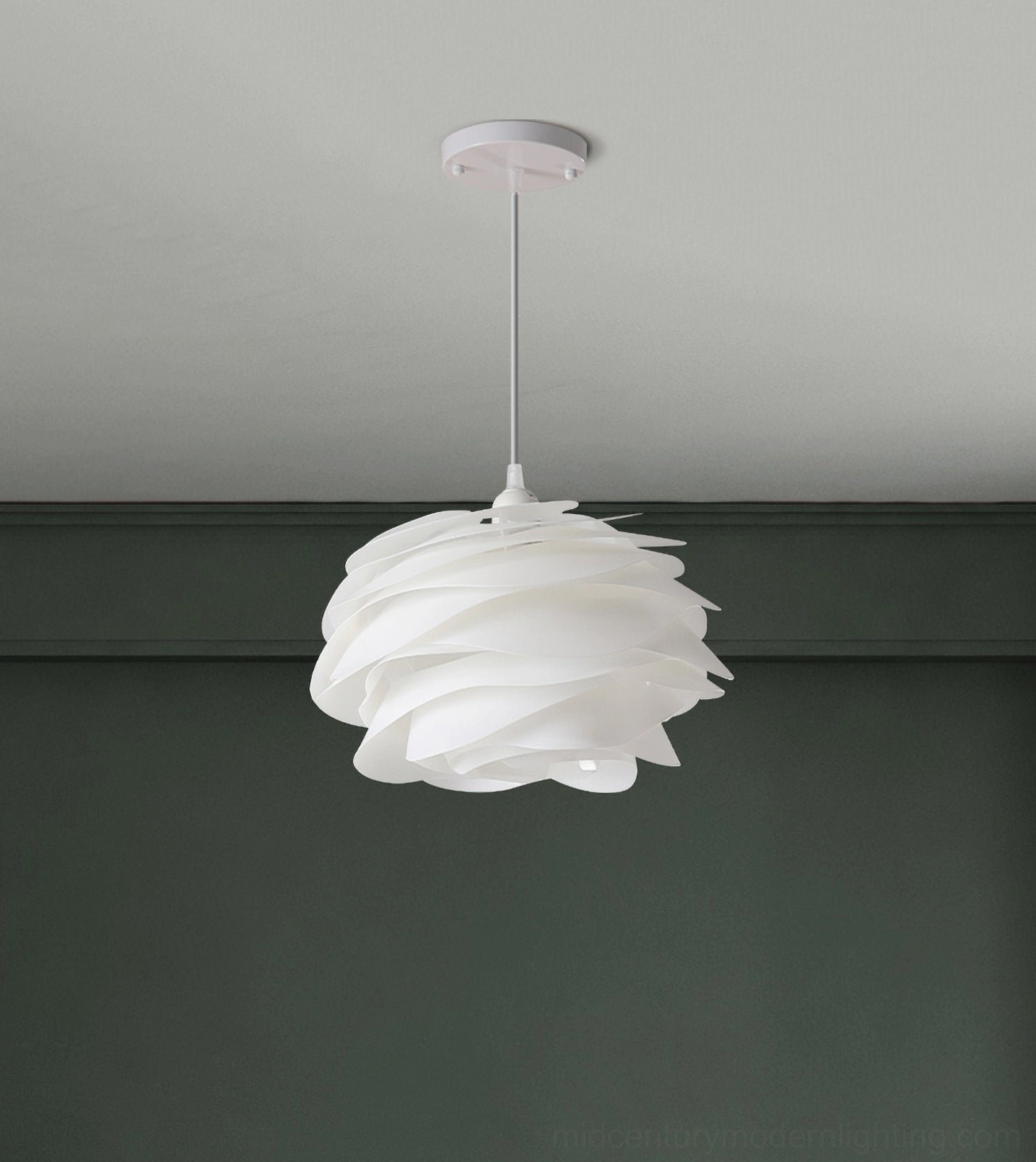Carmina pendant lamp with wavy petal design against forest green wall, Nordic minimalist lighting