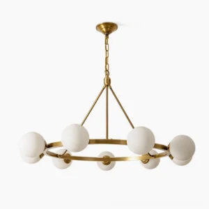 Carolee mid-century modern brass chandelier with six frosted white glass globe shades, front studio view
