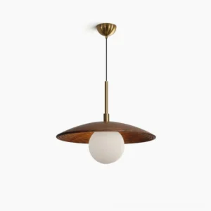 Caroll walnut and brass mid-century modern saucer pendant light with frosted white glass globe, front studio view