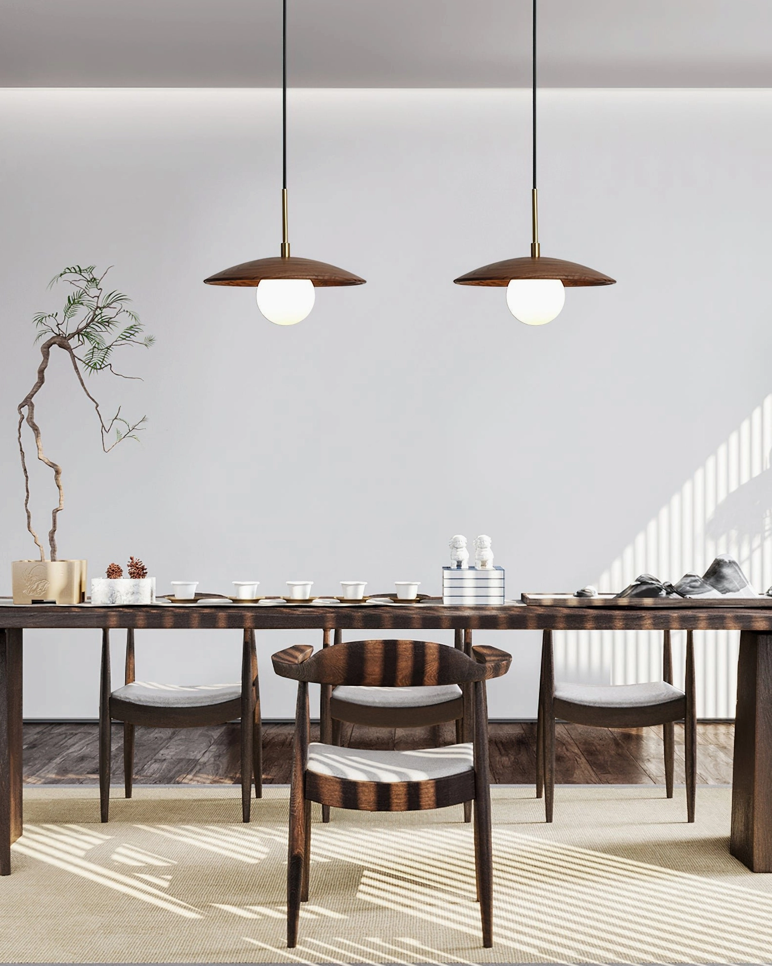 Two Caroll pendant lights in chinese-style dining room with wooden dining set and minimalist oriental decor