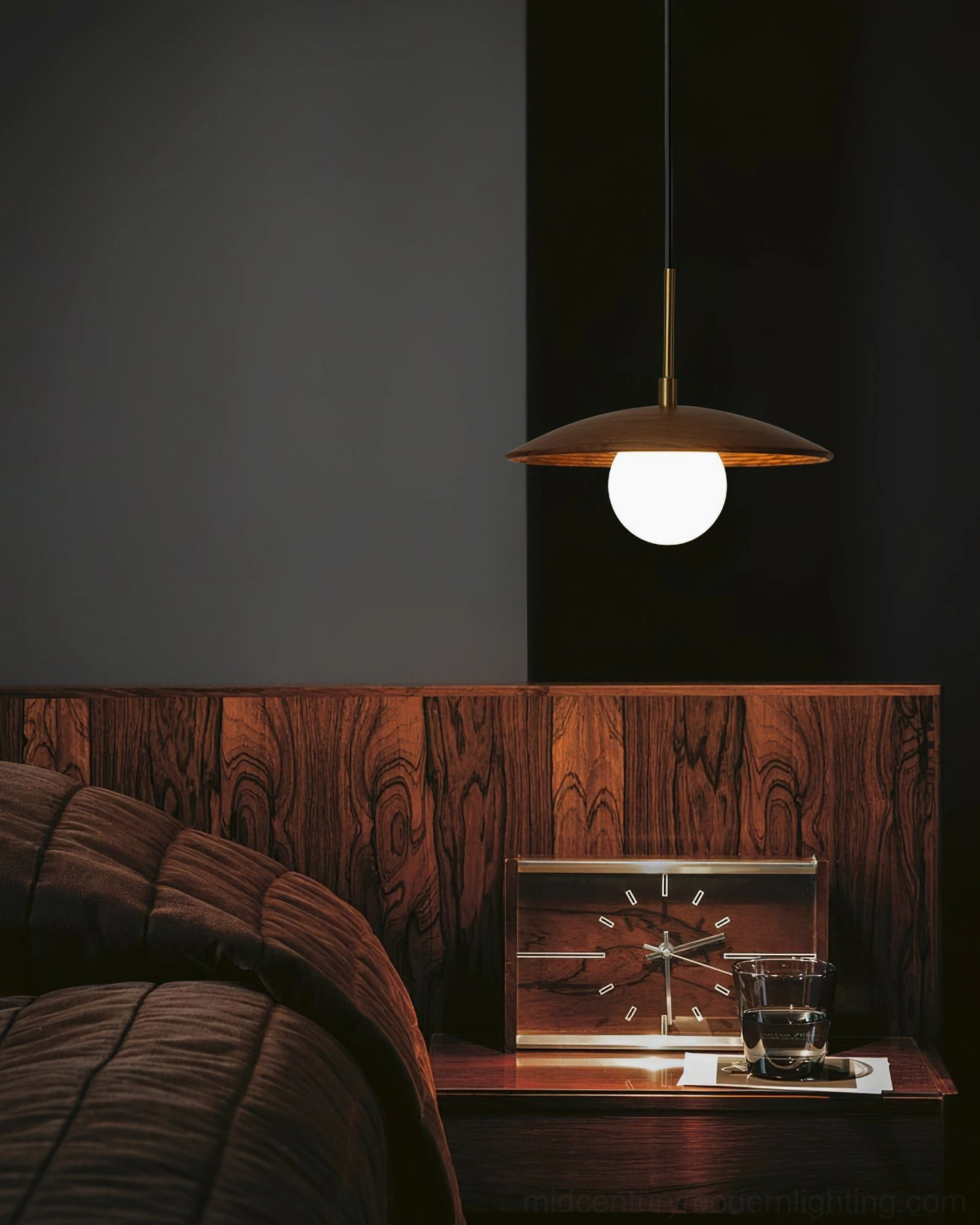 Caroll mid-century modern pendant light detail shot showing walnut wood shade and brass hardware