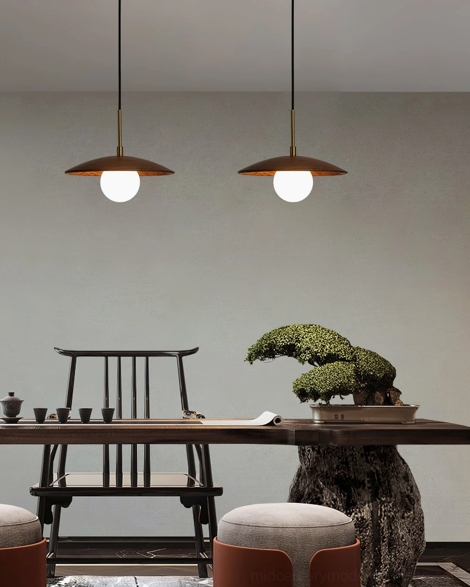 Two Caroll pendant lights in oriental minimalist tea room with potted plant and wooden furniture