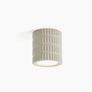 Carran ribbed ceiling light fixture with fluted cylindrical design in matte beige finish, front studio view