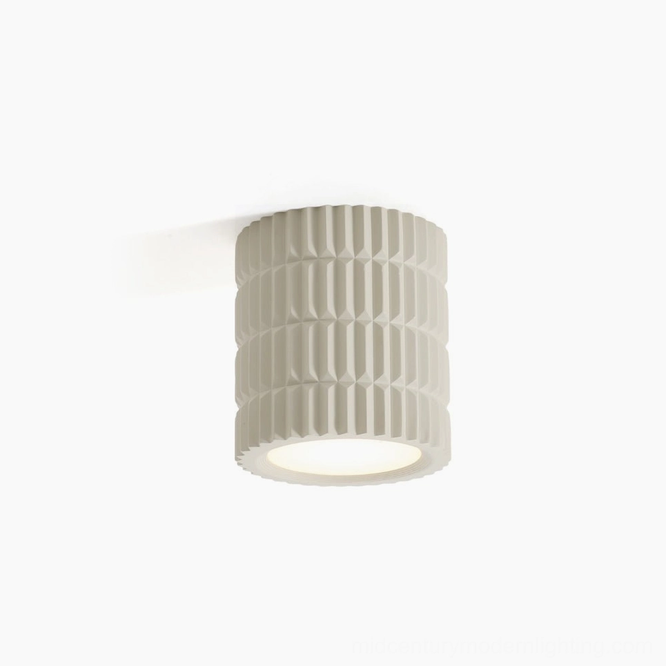 Carran ribbed ceiling light fixture with fluted cylindrical design in matte beige finish, front studio view