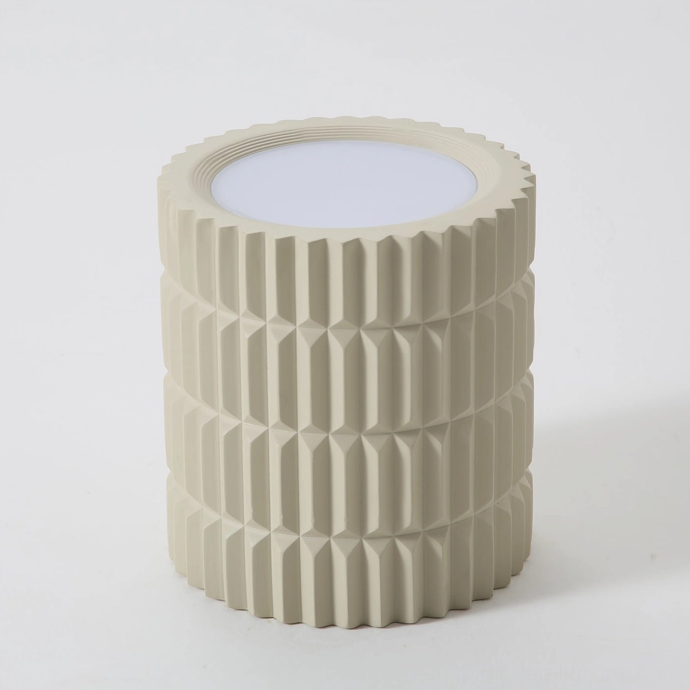 Unlit Carran ceiling fixture low-angle view, matte beige ribbed design flat top panel