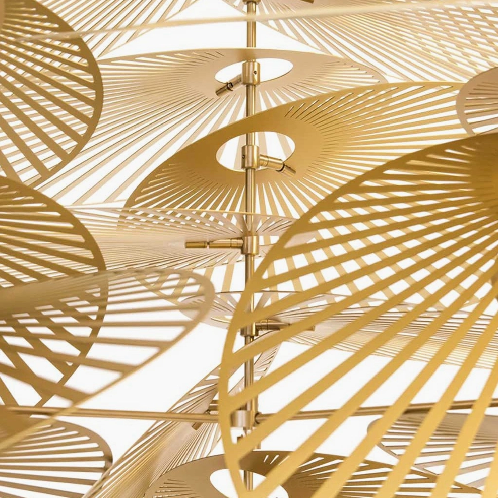 Cascade fan chandelier installed in high-ceiling space displaying cascading gold metal structure