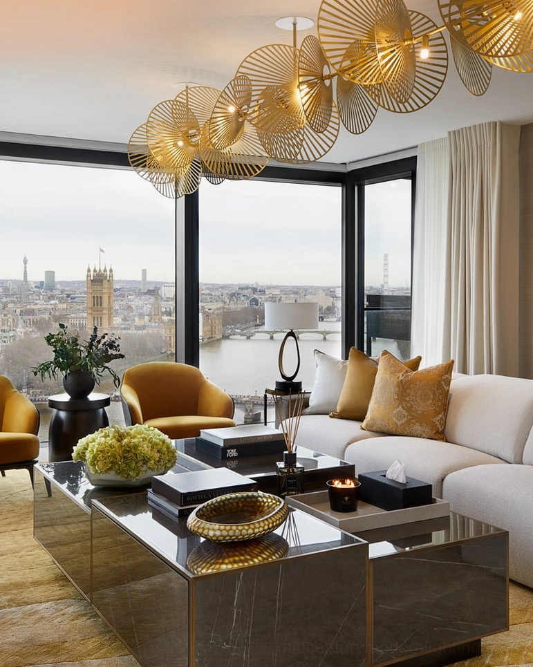 Wide ceiling cascade fan chandelier static view in high-end living room with city skyline backdrop