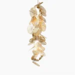Cascade fan chandelier side view showcasing cascading brushed gold metal fan discs in luxury minimalist style