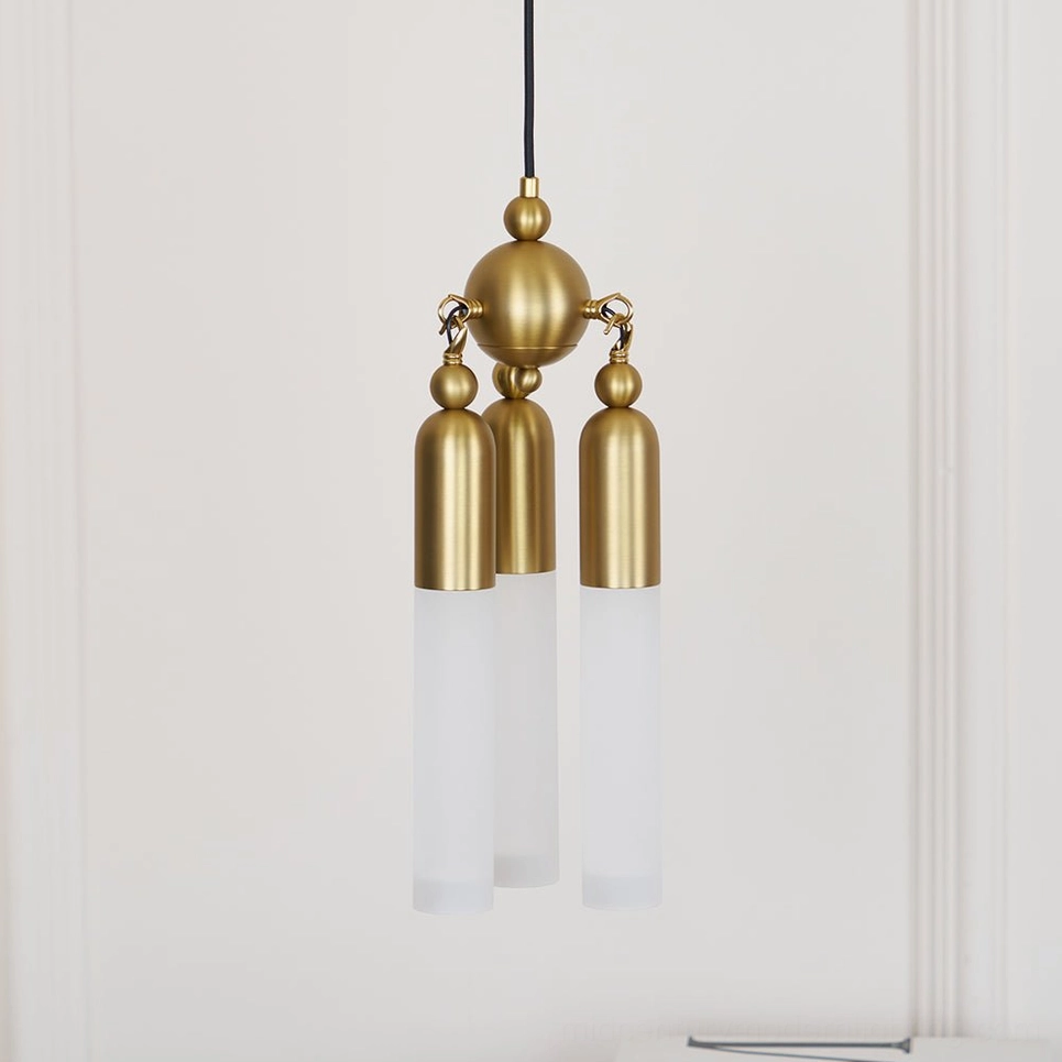 Cascadia pendant light in copper finish with warm white LED glow, angled product view showcasing mid-century modern design