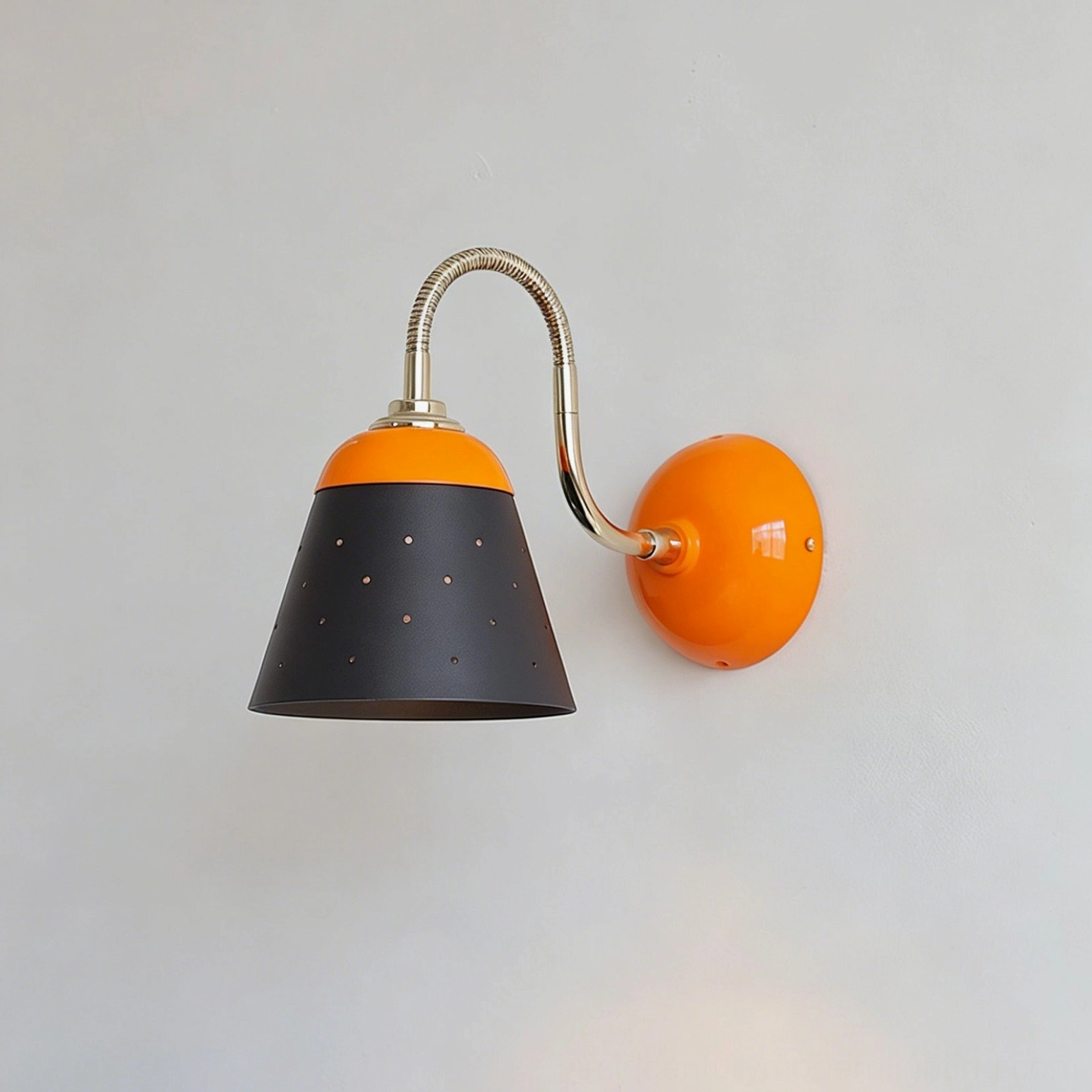 Casper retro funnel sconce front flat view, black and orange color scheme, industrial perforated shade