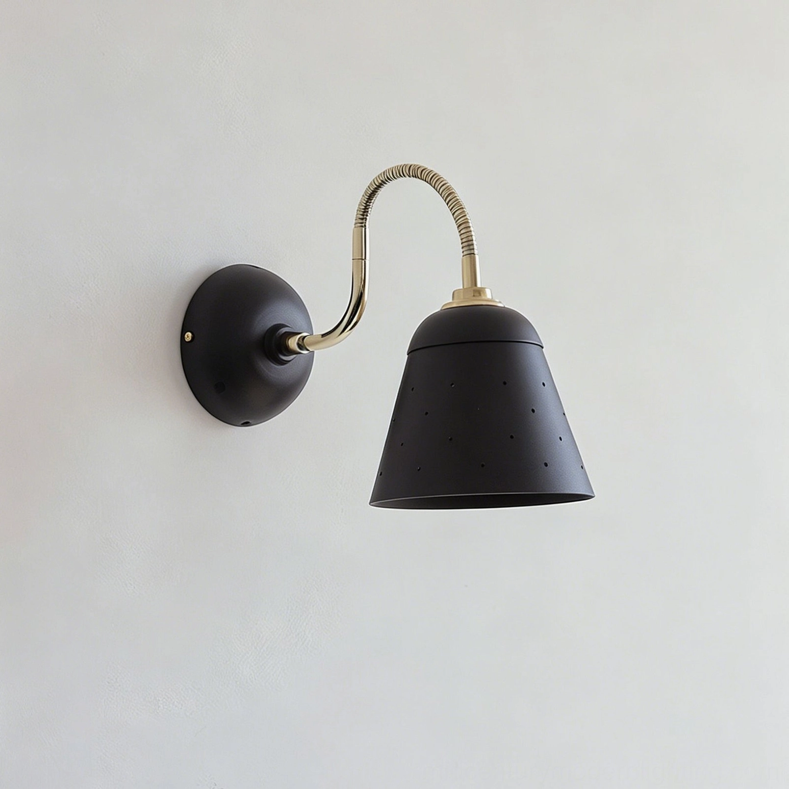 Casper wall sconce solid black finish mounted on wall, directional task lighting, architectural accent