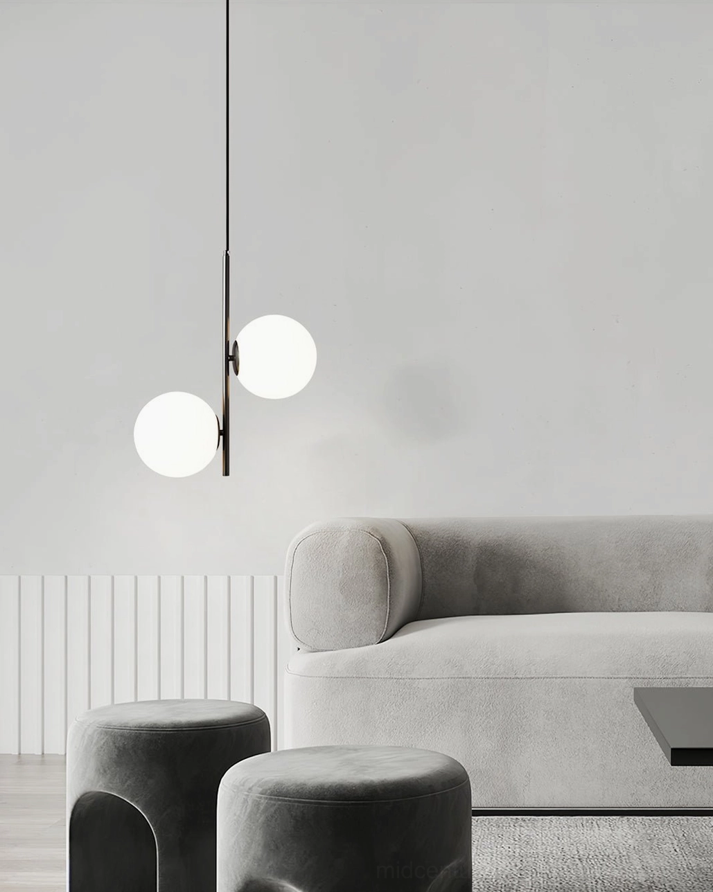 Castell double globe pendant lamp shown in black finish with geometric proportions and frosted white shade design