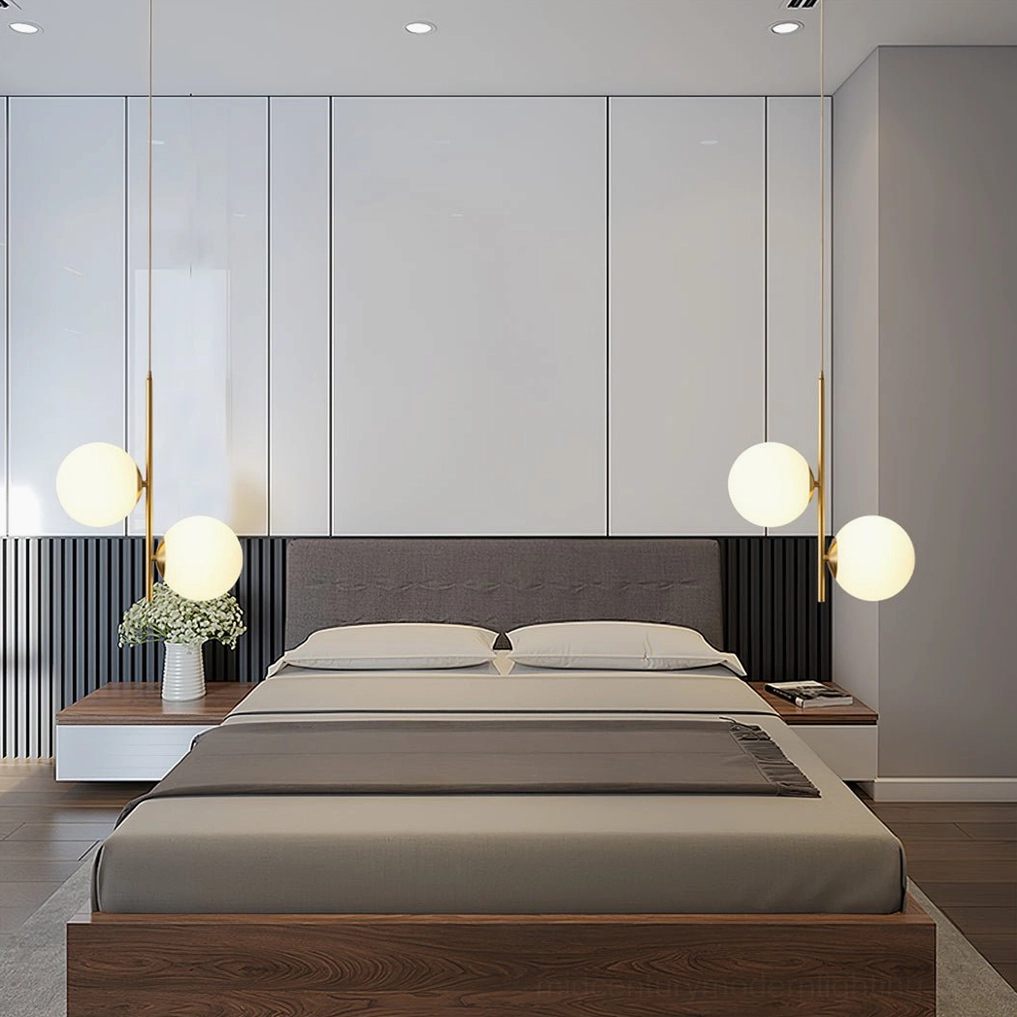 Castell mid-century modern double globe pendant light detailed product shot showing frosted glass shades and brass metal framework