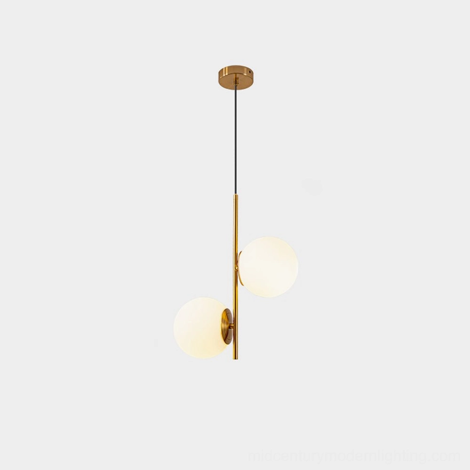 Castell double globe pendant light in gold brass finish with white frosted glass shades mid-century modern aesthetic