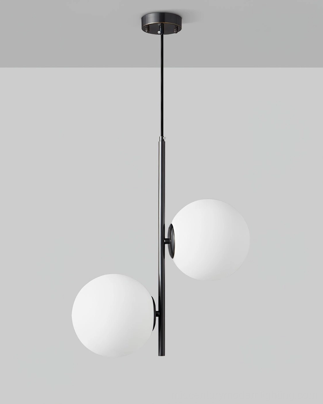 Side profile view of Castell double globe pendant light highlighting elegant proportions and suspension design