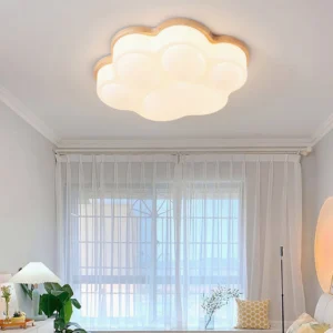 Cat paw ceiling light installed in minimalist bedroom with sheer window drapes, soft warm glow