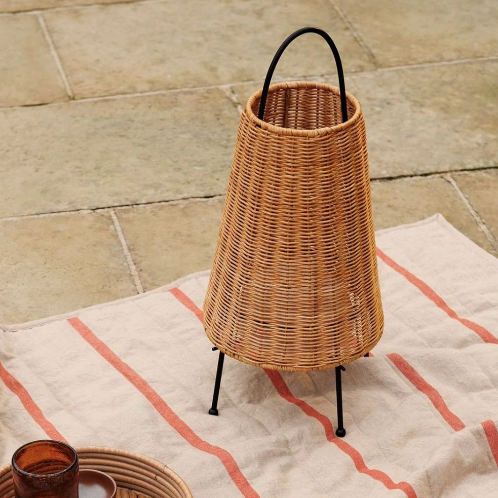 Catalina Coastal Table Lamp on outdoor tiled patio with natural linen mat and tableware styling, coastal modern aesthetic
