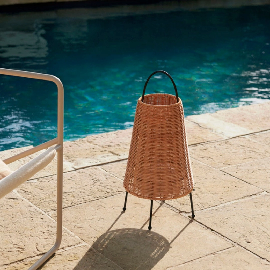 Catalina Coastal Table Lamp glowing on poolside stone terrace, coastal bohemian home decor setting