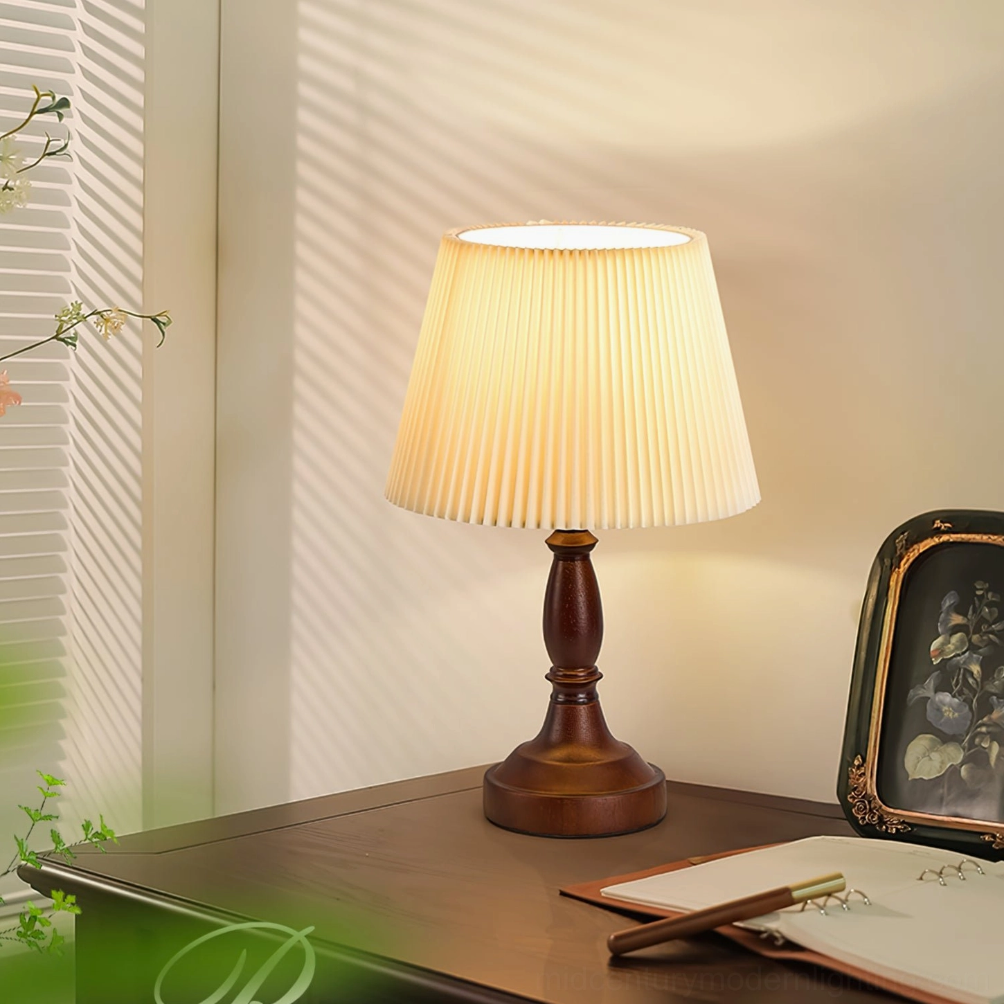 Mid-century modern pleated shade lamp placed on wooden side table with vintage storage decor