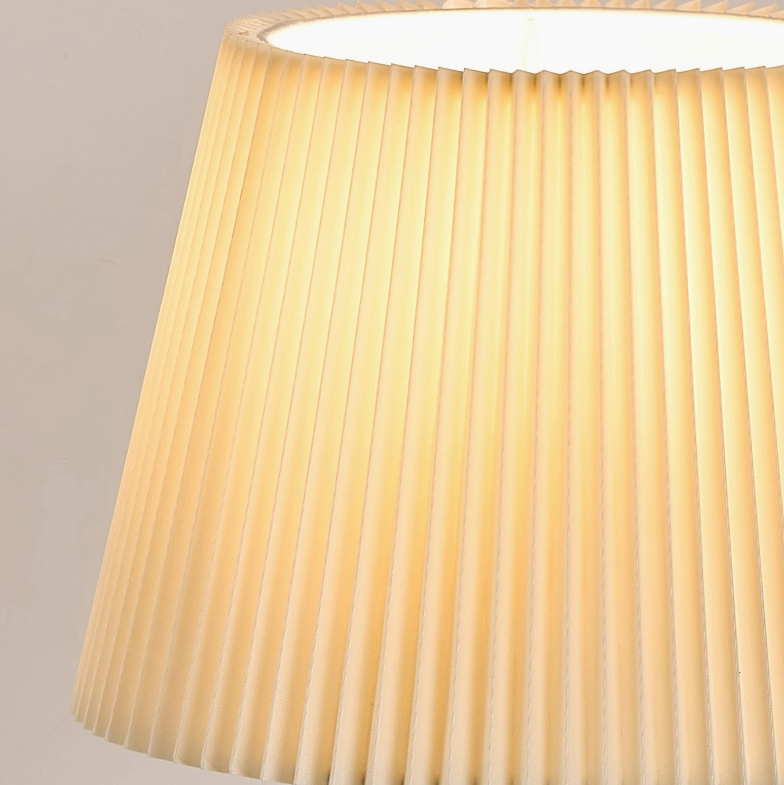 Vintage inspired pleated shade table lamp showcasing warm wood grain and timeless mid-century modern craftsmanship