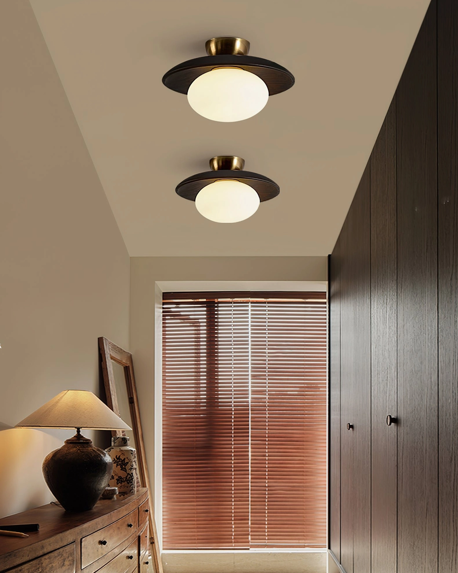 Dual Cathy ceiling lamps in bedroom hallway with dark walnut wood discs and warm ambient lighting