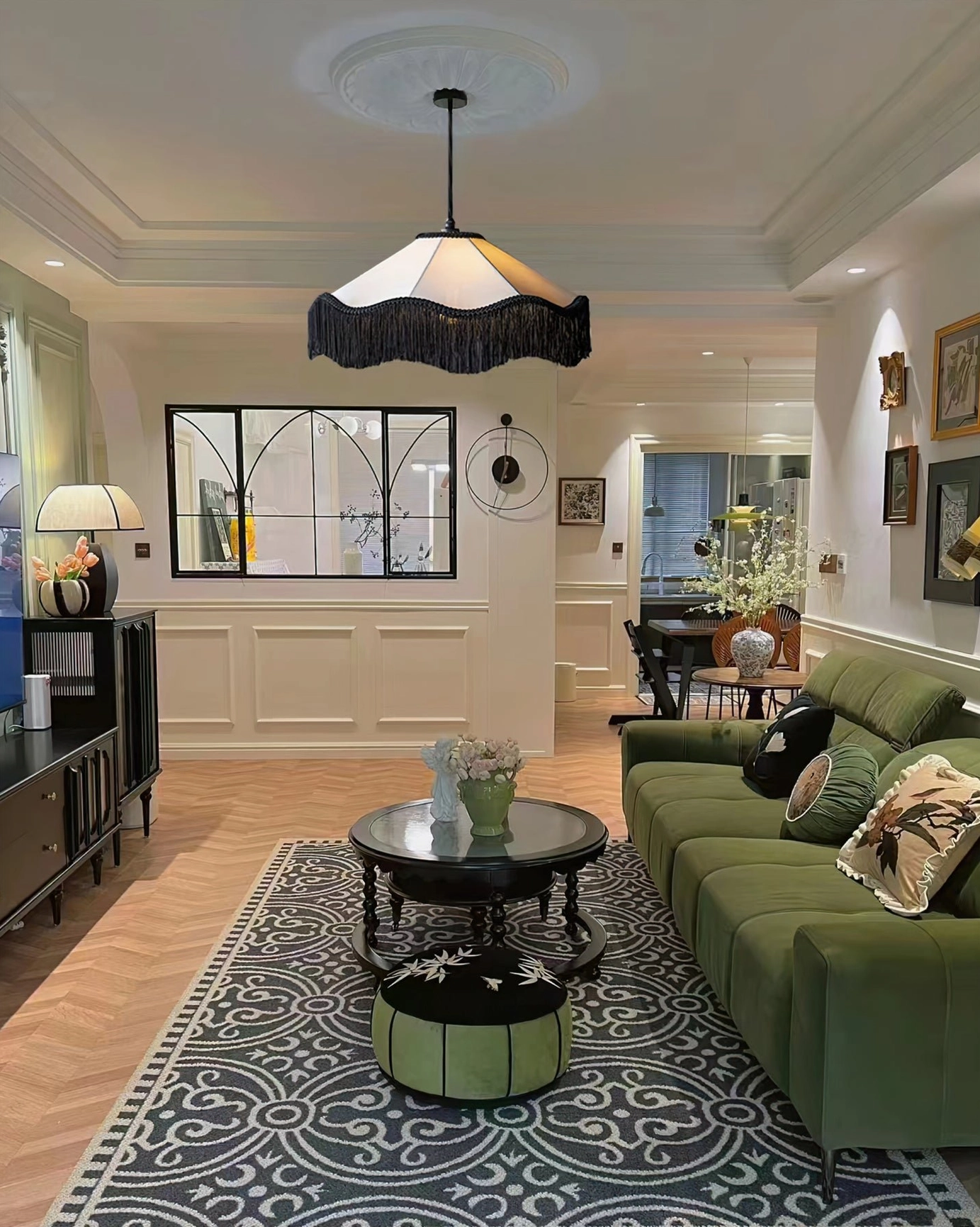 Cecile Tassel Pendant Lamp in vintage luxury living room with green velvet sofa, patterned area rug and gallery wall decoration