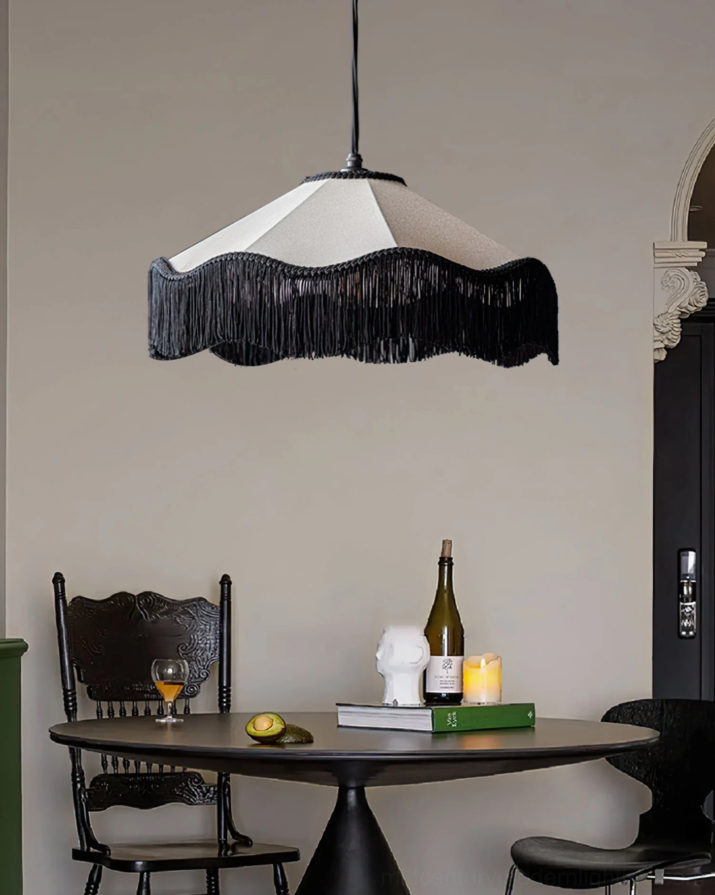 Cecile Tassel Pendant Lamp in minimalist dining space with vintage black dining chair and coordinated tabletop decor