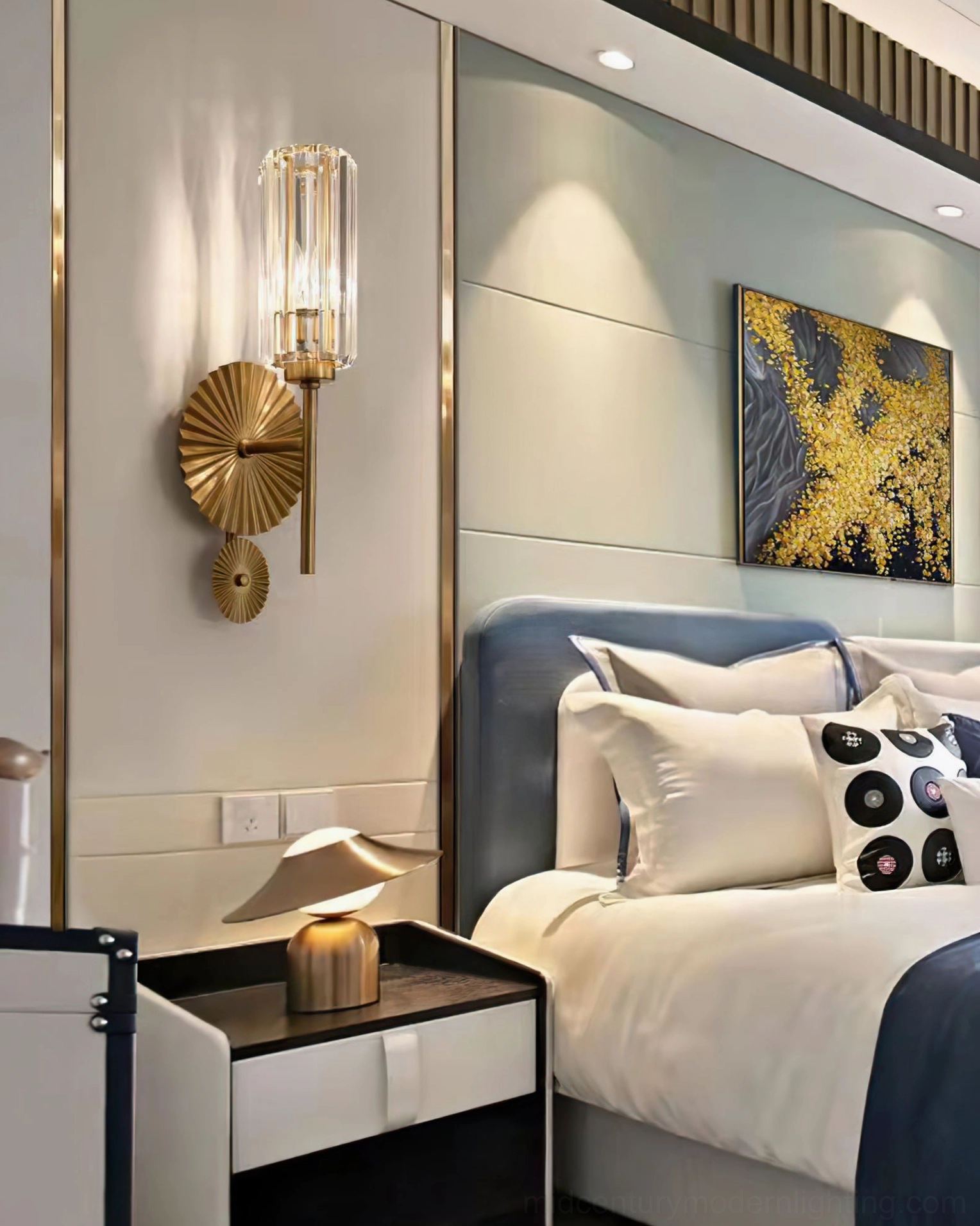 Cecily brass wall sconce illuminated showing light diffusion through ribbed crystal shade
