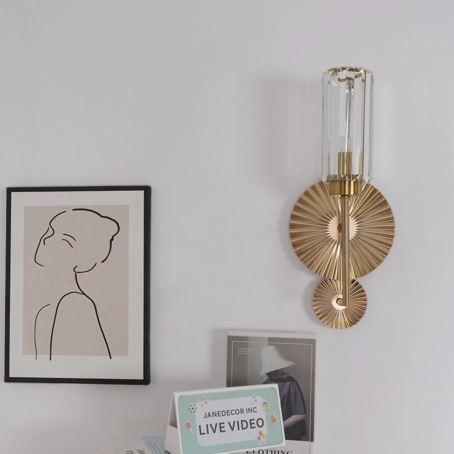 Cecily brass wall sconce detailed view of metal mounting bracket and glass shade connection