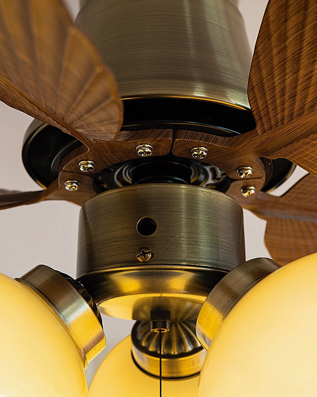 Beige finish ceiling fan light installed in minimalist modern living space with neutral palette
