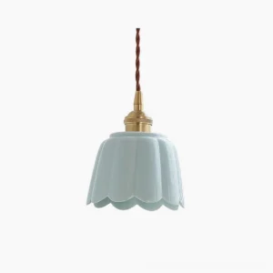 Celadon fluted ceramic pendant light with aqua blue finish and brass hardware, front studio view